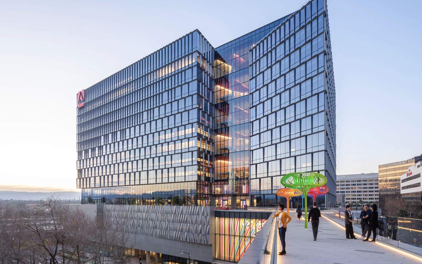 A professional financial analyst reviewing Adobe stock analysis charts on a digital screen
