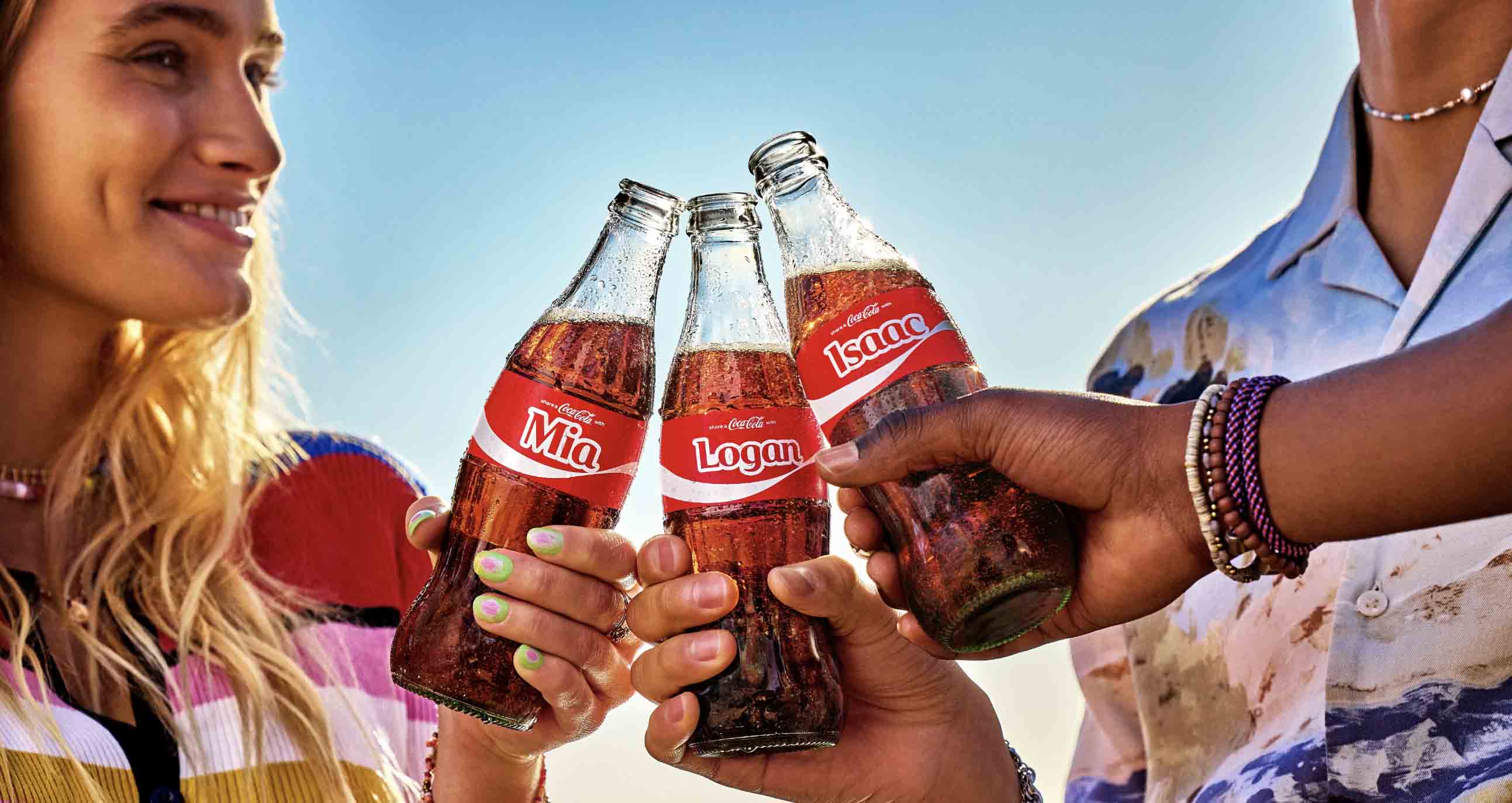 The iconic red and white Coca-Cola logo on a glass bottle representing a stable stock investment.