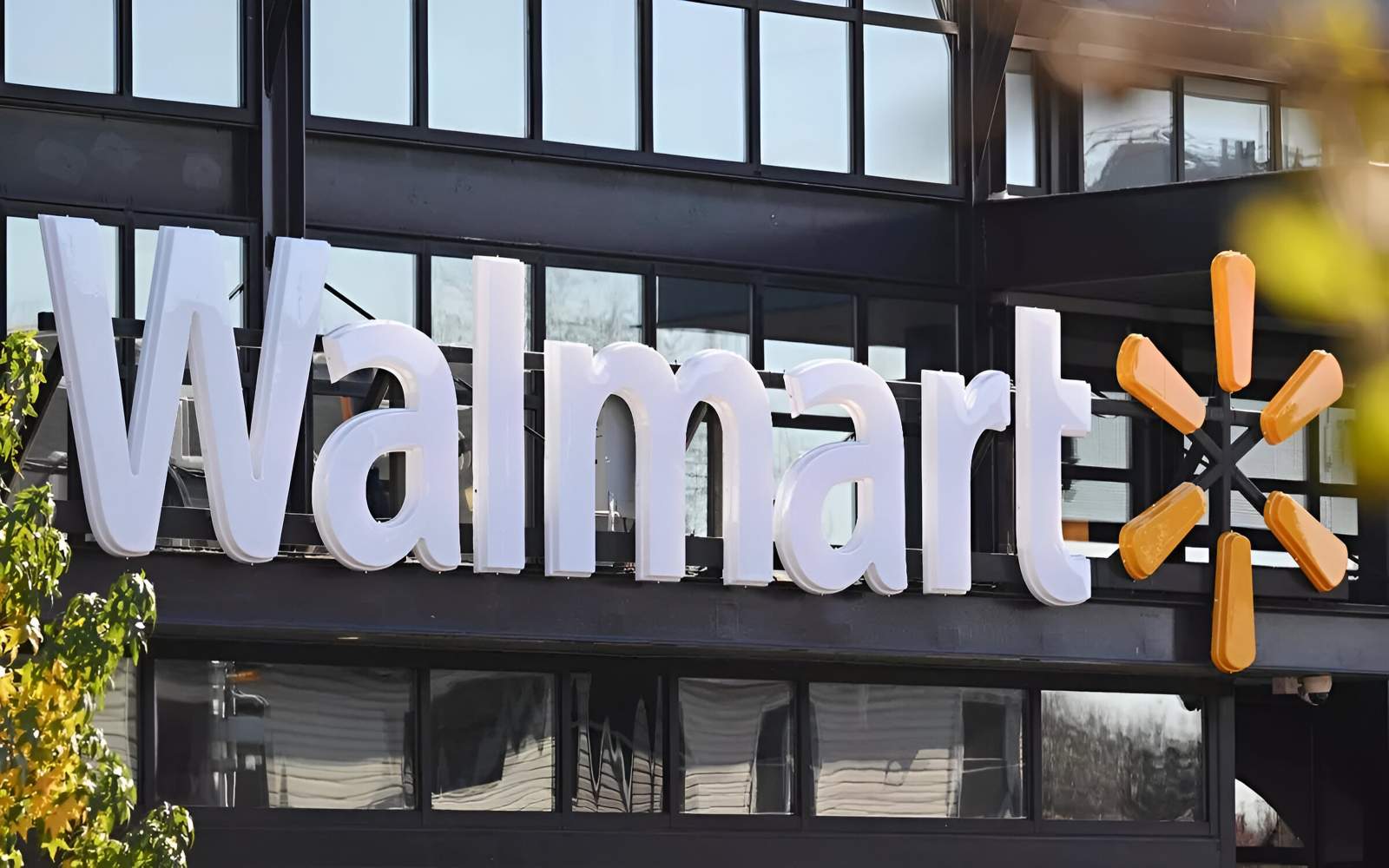 A shopping cart filled with dollar signs, superimposed over a chart of Walmart's stock performance, representing stock market analysis and investment opportunities.